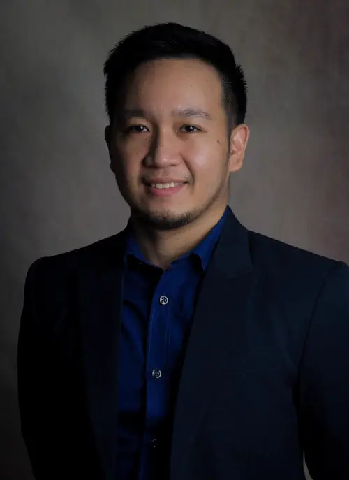 My picture, a shot of a Filipino in a corporate setting. Good paying job but not true freedom.